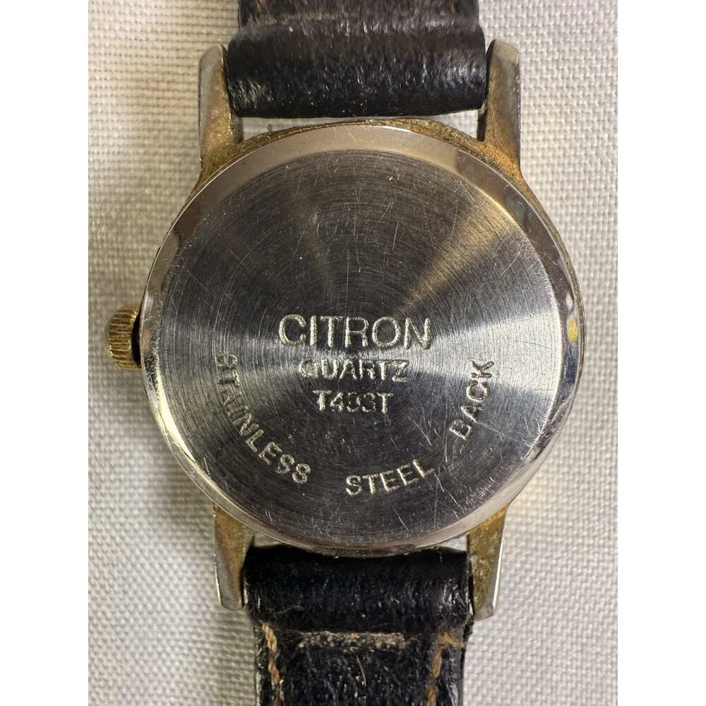 Citron Vintage Women’s Watch, White dial and gold casing. Black leather band.